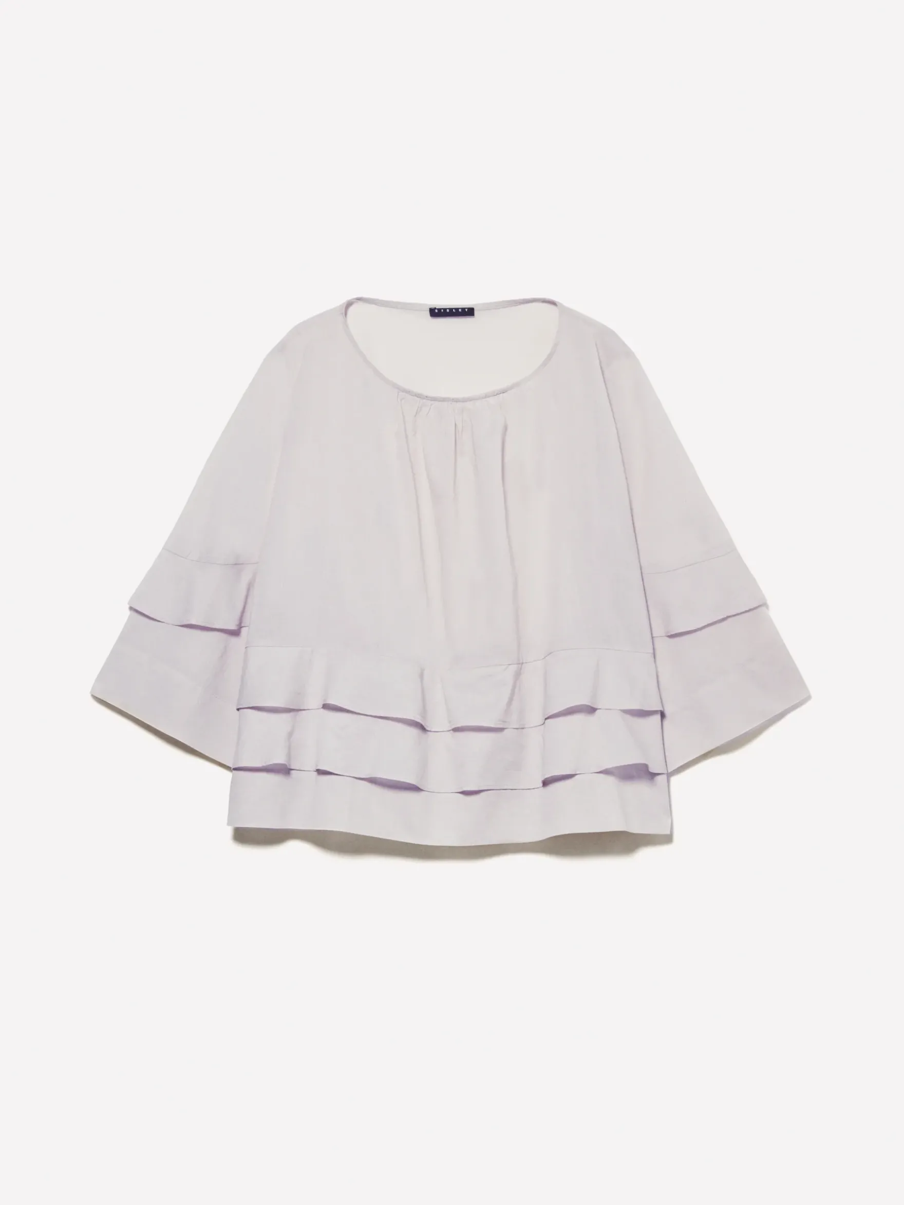 Blusa grigia con balze